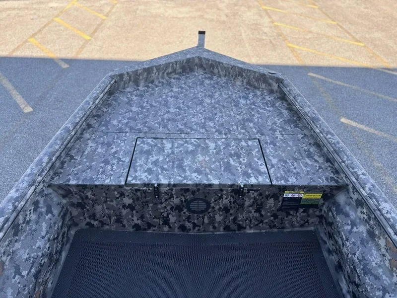 Slide: The Image of 2025 Havoc 1656 VJST boat with camouflage pattern, viewed from above in a parking lot. - 11