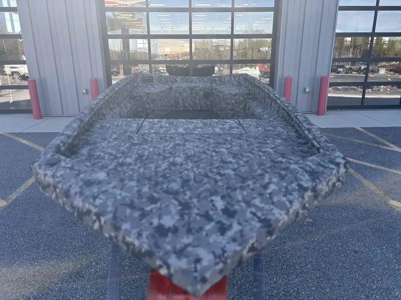 Slide: The Image of 2025 Havoc 1656 VJST boat with camouflage design, displayed outdoors. - 9