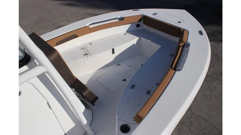 Slide: The Image of 2025 Sea Pro 202 CC boat interior with cushioned seating and storage compartments. - 11