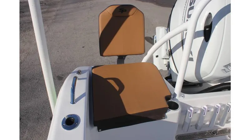 Slide: The Image of 2025 Sea Pro 202 CC boat seat and motor detail, featuring tan upholstery and white accents. - 7