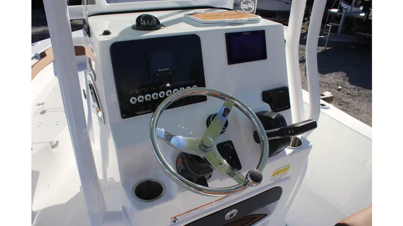 Slide: The Image of 2025 Sea Pro 202 CC boat console with steering wheel and navigation controls. - 8