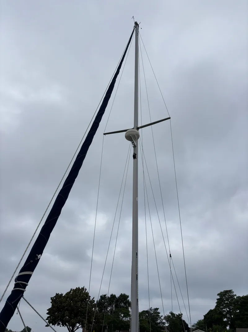 Slide: The Image of Mast of 2002 Catalina 36MKII sailboat against cloudy sky. - 23