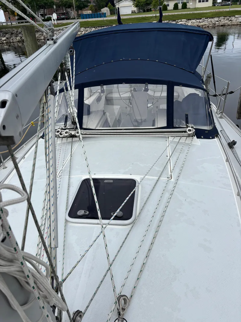 Slide: The Image of 2002 Catalina 36MKII sailboat deck with blue canopy and rigging in marina. - 24