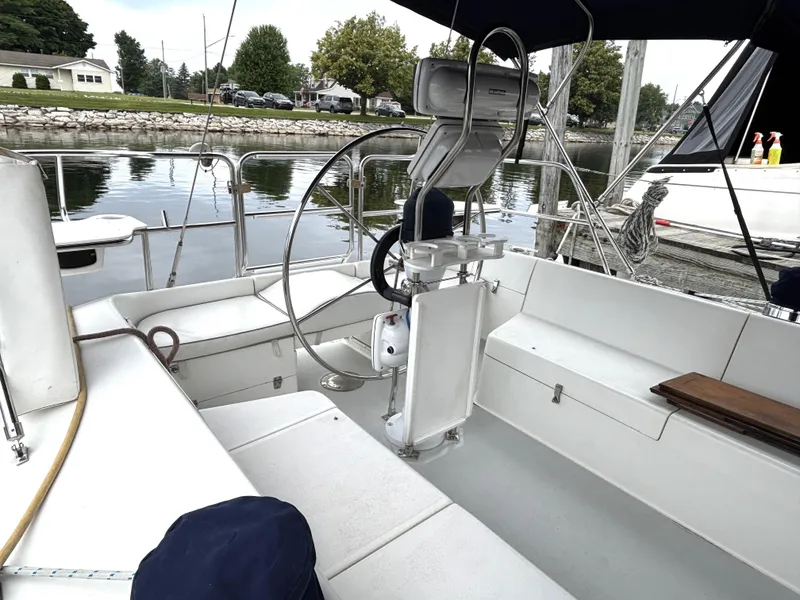 Slide: The Image of Cockpit of 2002 Catalina 36MKII sailboat docked by a calm waterfront. - 28