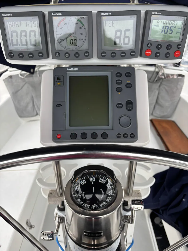Slide: The Image of Cockpit of 2002 Catalina 36MKII sailboat with Raytheon navigation instruments and compass. - 29