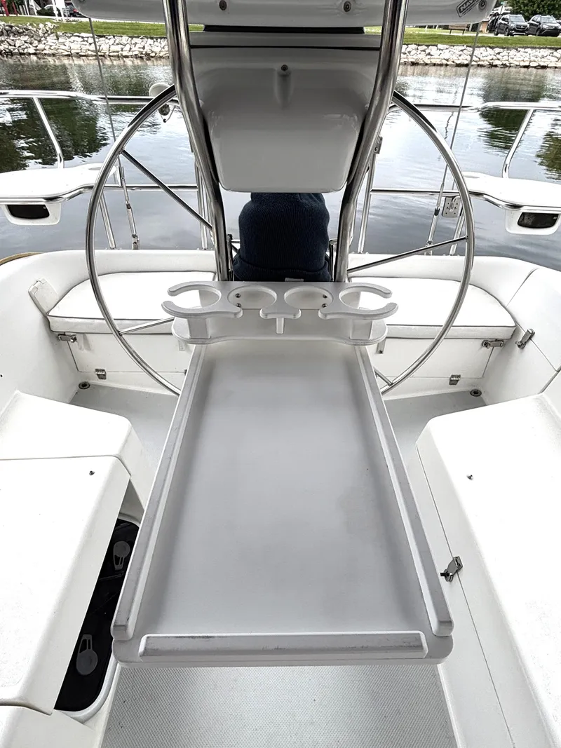 Slide: The Image of Cockpit of 2002 Catalina 36MKII sailboat with steering wheel and cup holders. - 35