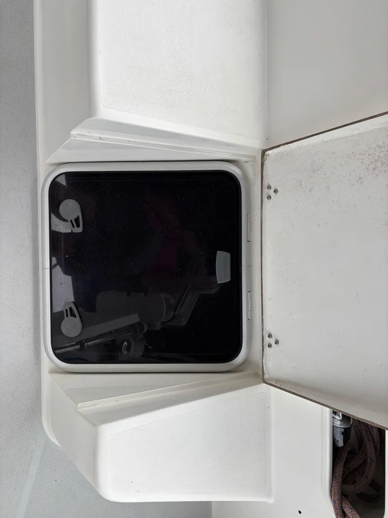 Slide: The Image of Hatch on a 2002 Catalina 36MKII sailboat, partially open with visible hardware. - 43