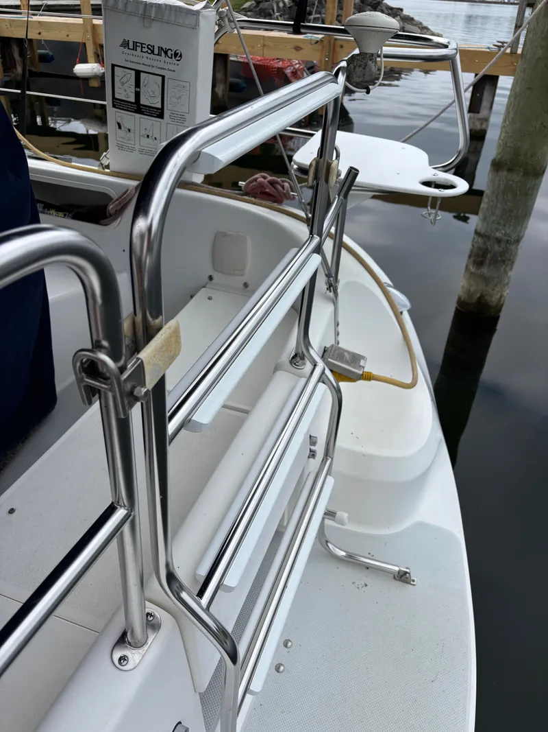 Slide: The Image of Catalina 36MKII sailboat stern with stainless steel railings, docked at marina, 2002 model. - 49