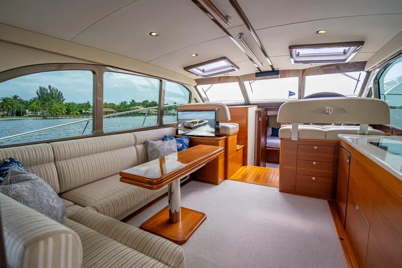 Slide: The Image of Luxurious interior of 2018 Palm Beach Motor Yachts PB45 with elegant seating and panoramic windows. - 2