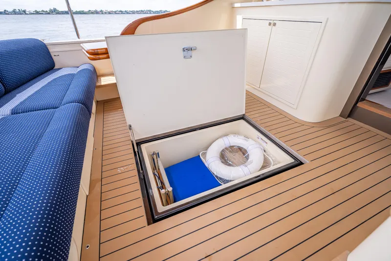 Slide: The Image of 2018 Palm Beach Motor Yachts PB45 interior with open storage compartment on deck. - 21