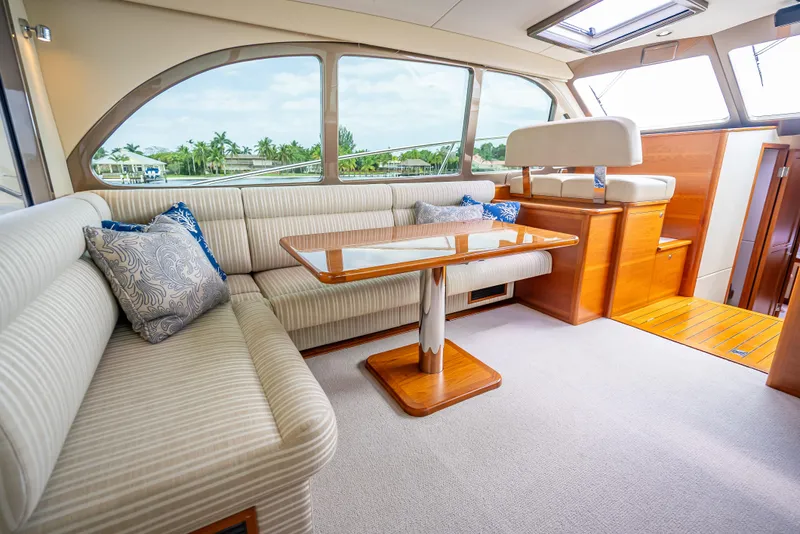 Slide: The Image of Luxurious interior of 2018 Palm Beach Motor Yachts PB45 with elegant seating and wooden accents. - 26