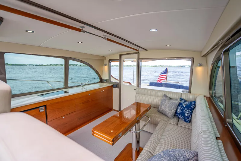 Slide: The Image of Luxurious 2018 Palm Beach Motor Yachts PB45 interior with elegant seating and scenic water views. - 29