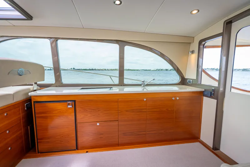 Slide: The Image of Interior of 2018 Palm Beach Motor Yachts PB45 with wooden cabinetry and ocean view. - 35