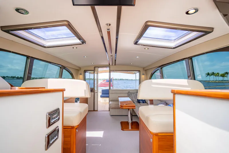 Slide: The Image of 2018 Palm Beach Motor Yachts PB45 interior with skylights and waterfront view. - 39