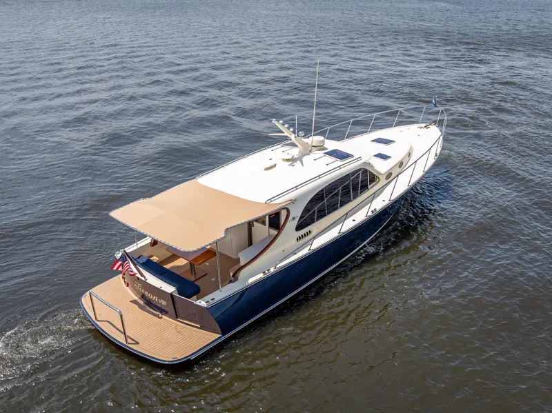Slide: The Image of 2018 Palm Beach Motor Yachts PB45 cruising on open water, aerial view. - 4