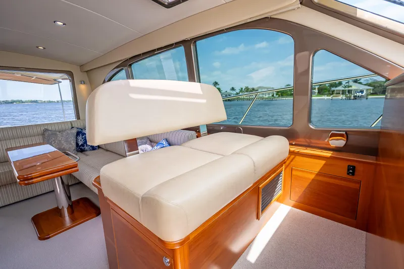 Slide: The Image of Interior of 2018 Palm Beach Motor Yachts PB45, featuring elegant seating and scenic water views. - 41