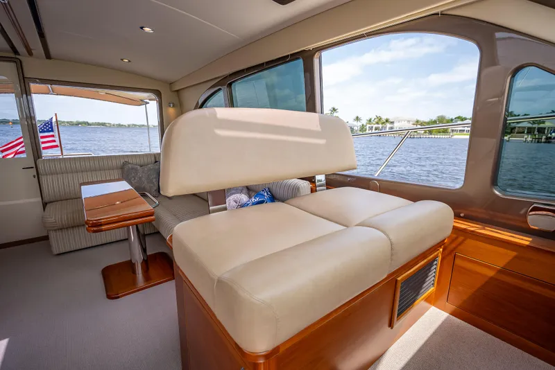 Slide: The Image of Interior of 2018 Palm Beach Motor Yachts PB45, featuring elegant seating and scenic water views. - 42