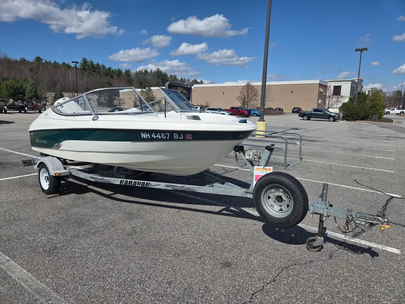 Slide: The Image of Silverline 1600 boat on trailer in parking lot, clear sky, 2003 model. - 3
