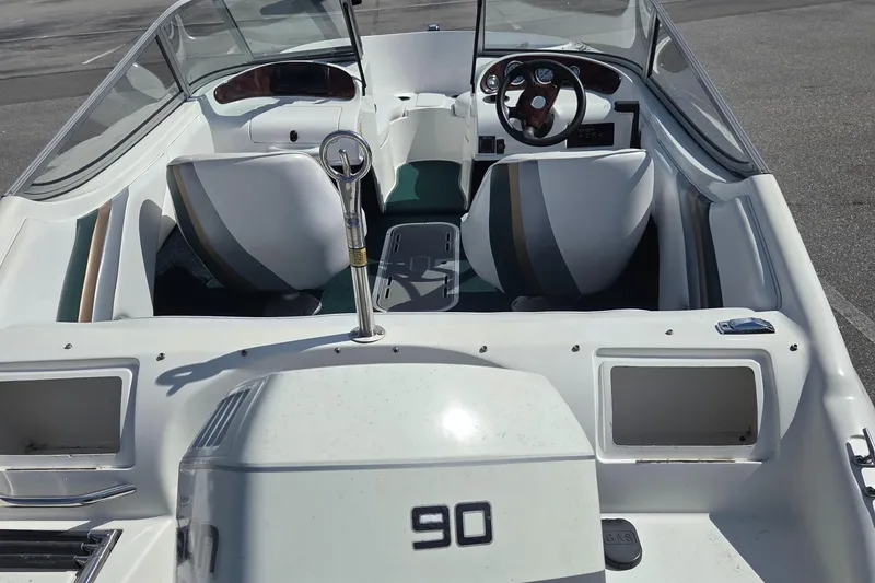 Slide: The Image of Silverline 1600 boat interior, 2003 model, featuring dual seats and steering wheel. - 5