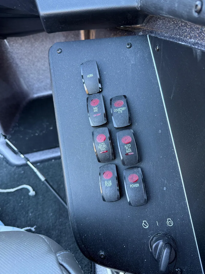 Slide: The Image of Control panel of a 2025 Skeeter ZXR 20 SE boat with multiple switches. - 10