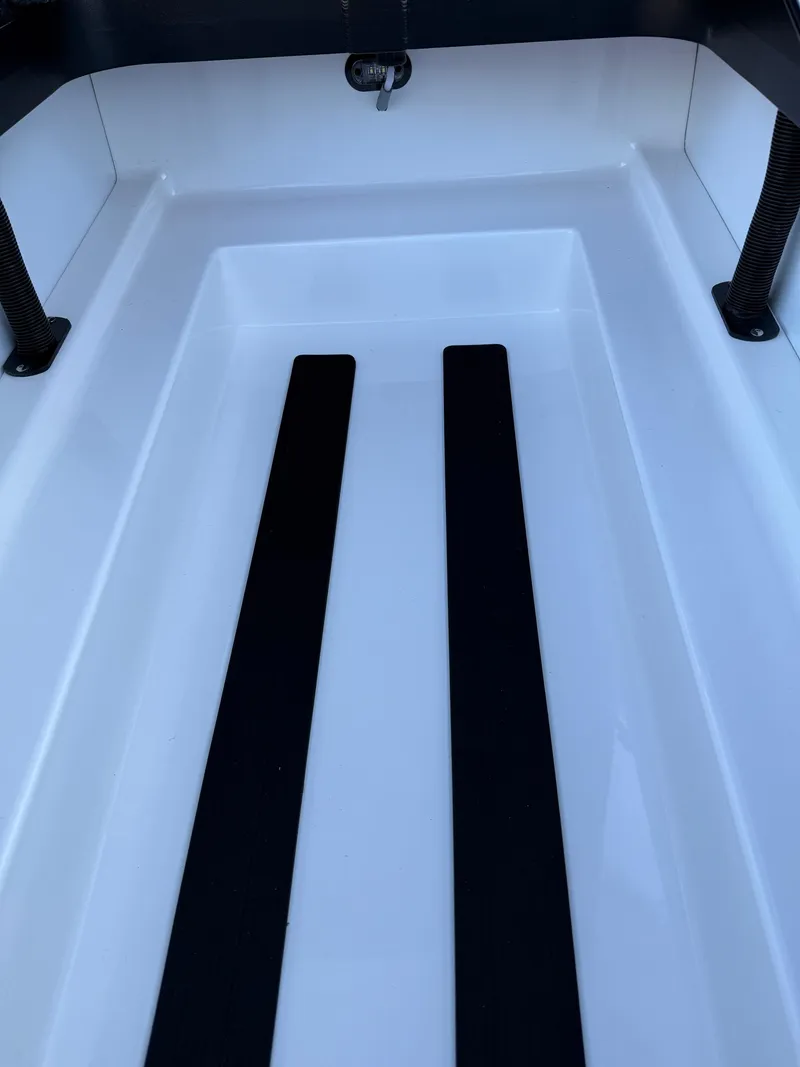 Slide: The Image of Interior view of 2025 Skeeter ZXR 20 SE boat, featuring sleek white and black design. - 18