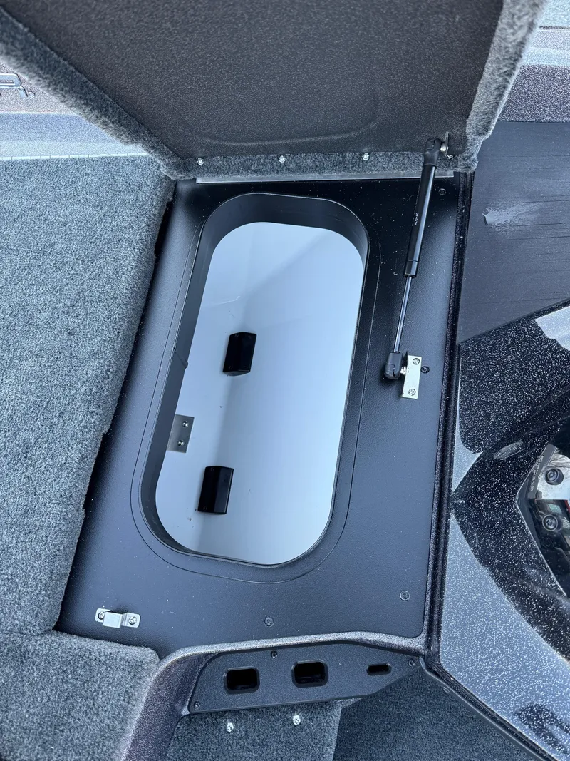 Slide: The Image of Open storage compartment in 2025 Skeeter ZXR 20 SE boat. - 21