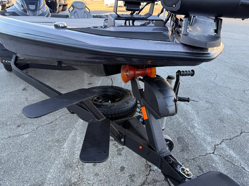Slide: The Image of 2025 Skeeter ZXR 20 SE boat on trailer, showing hull and propeller details. - 6