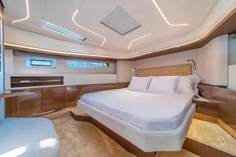 Slide: The Image of Luxurious 2025 Prestige F4.9 yacht bedroom with modern design and ambient lighting. - 26