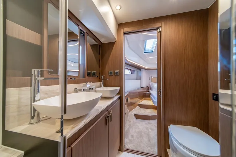 Slide: The Image of Luxurious bathroom interior of 2025 Prestige F4.9 yacht with modern fixtures and wood accents. - 29