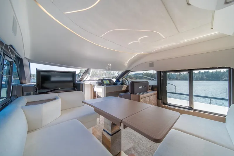 Slide: The Image of Luxurious interior of 2025 Prestige F4.9 yacht with modern seating and panoramic windows. - 39