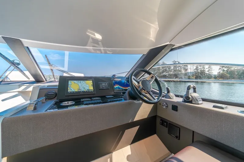 Slide: The Image of Modern helm of 2025 Prestige F4.9 yacht with advanced navigation systems and scenic view. - 41