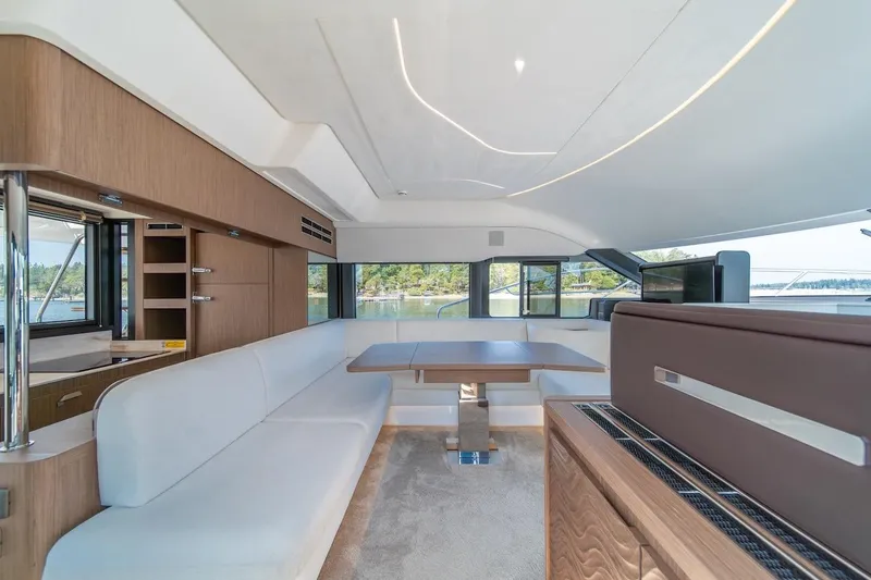 Slide: The Image of Luxurious interior of 2025 Prestige F4.9 yacht with modern seating and panoramic windows. - 43