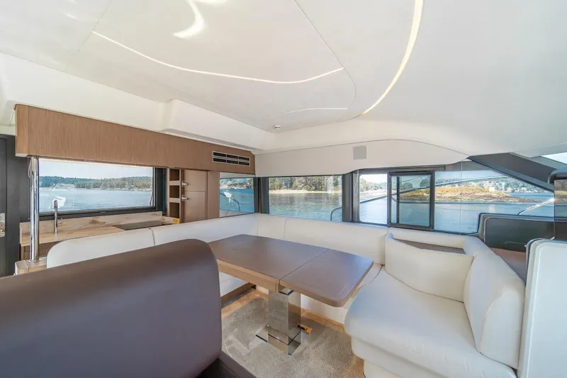 Slide: The Image of Luxurious interior of 2025 Prestige F4.9 yacht with panoramic windows and elegant seating. - 45