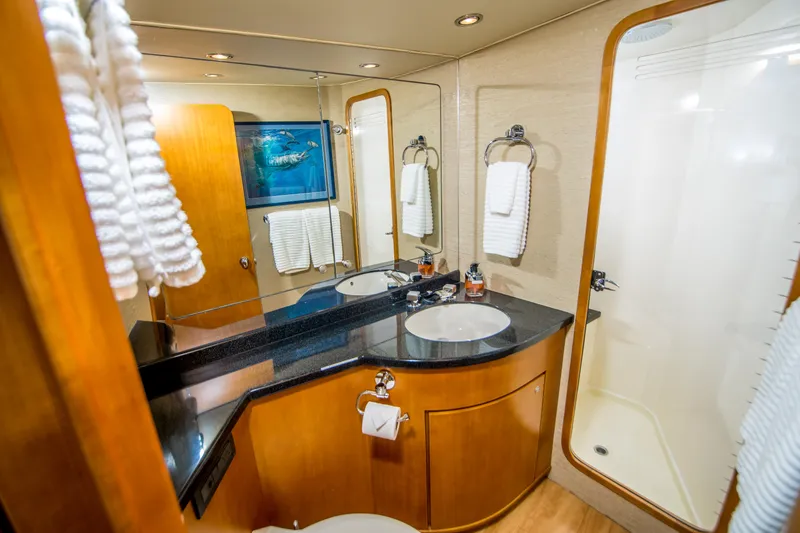 Slide: The Image of Luxurious bathroom in 2003 Donzi R65 yacht with modern fixtures and elegant design. - 14