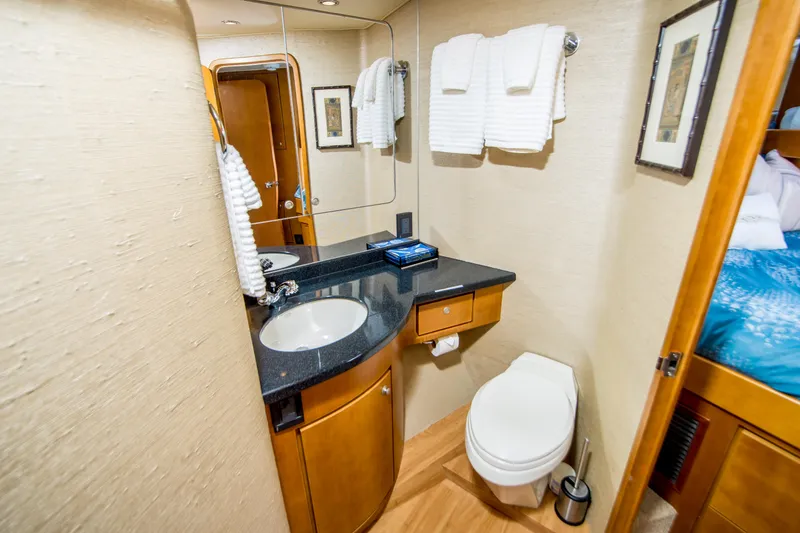 Slide: The Image of Luxurious bathroom in 2003 Donzi R65 yacht with modern fixtures and elegant design. - 18