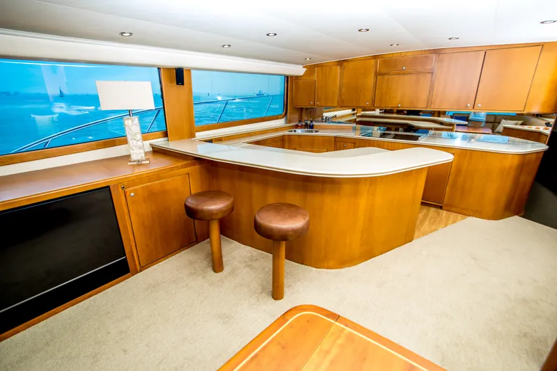 Slide: The Image of Luxurious 2003 Donzi R65 yacht interior with modern kitchen and seating area. - 9