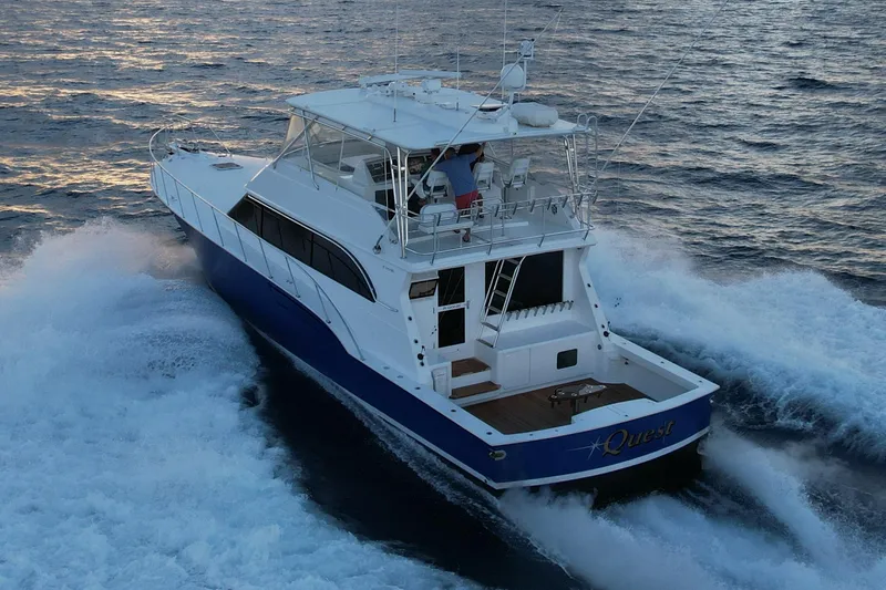 Slide: The Image of 2003 Donzi R65 yacht cruising on open water, showcasing sleek design and powerful performance. - 1