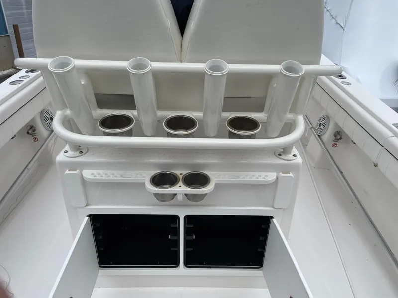 Slide: The Image of 2016 Regulator 28 boat with rod holders and storage compartments. - 13
