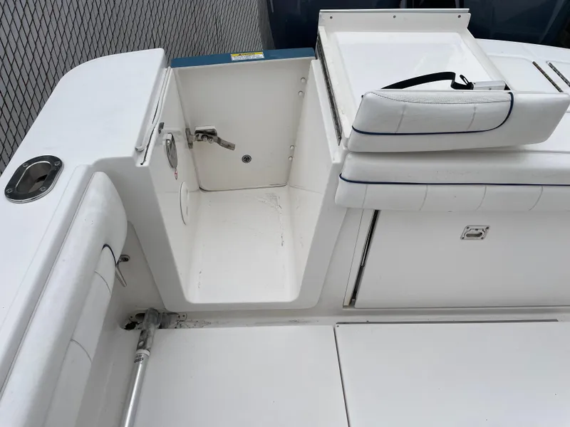 Slide: The Image of 2016 Regulator 28 boat interior with seating and storage compartments. - 22