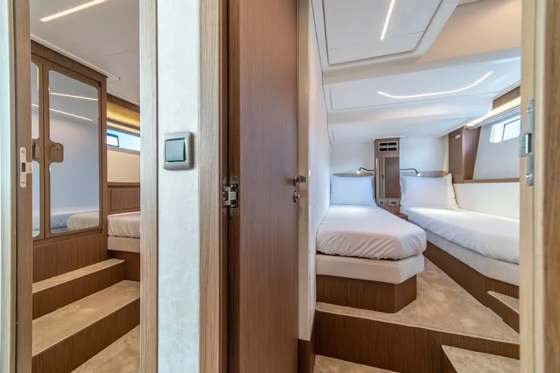 Slide: The Image of Luxurious cabin interior of 2025 Prestige F4.9 yacht with twin beds and modern design. - 33