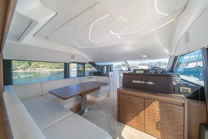 Slide: The Image of Luxurious interior of 2025 Prestige F4.9 yacht with elegant seating and scenic views. - 42