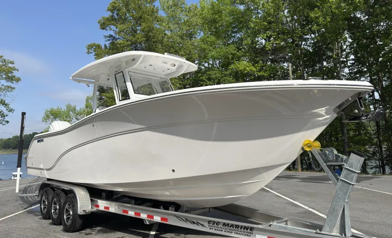 Slide: The Image of 2025 Sea Fox 288 Commander boat console with control panel and storage compartments. - 10