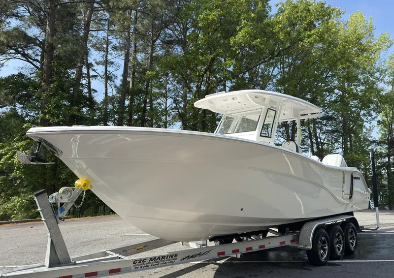 Slide: The Image of 2025 Sea Fox 288 Commander boat docked, featuring spacious seating and sleek design. - 11