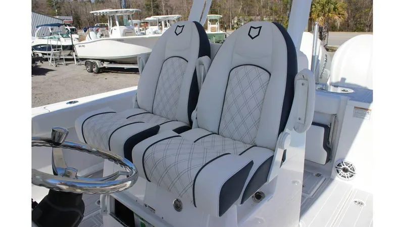 Slide: The Image of 2025 Sea Fox 288 Commander boat dashboard with dual screens and steering wheel. - 5