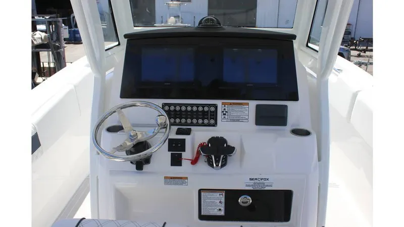 Slide: The Image of 2025 Sea Fox 288 Commander boat interior with spacious seating and table. - 6