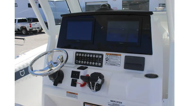 Slide: The Image of 2025 Sea Fox 288 Commander boat with spacious, cushioned seating area. - 7