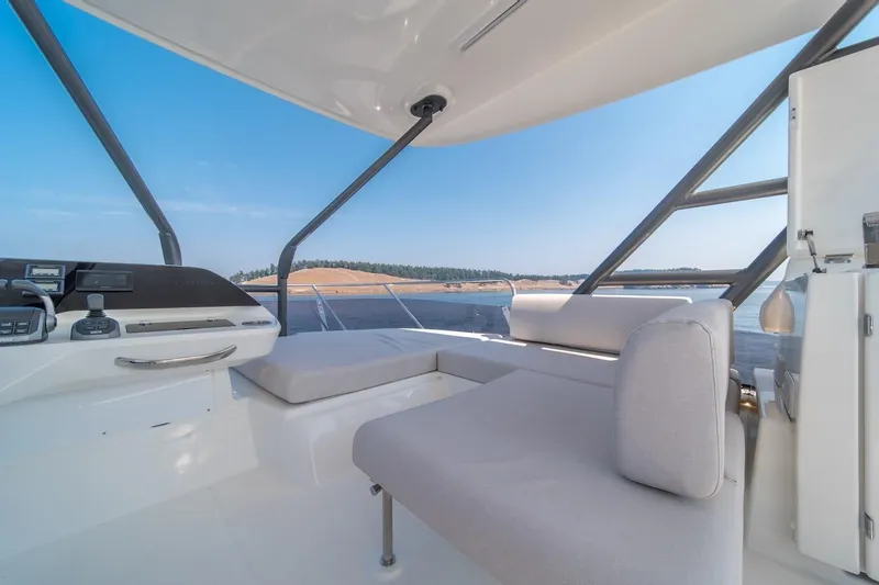 Slide: The Image of Luxurious interior of 2025 Prestige F4.9 yacht with scenic ocean view. - 25