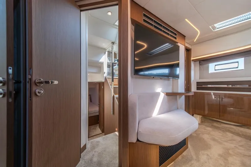 Slide: The Image of Luxurious interior of 2025 Prestige F4.9 yacht with modern furnishings and sleek design. - 30