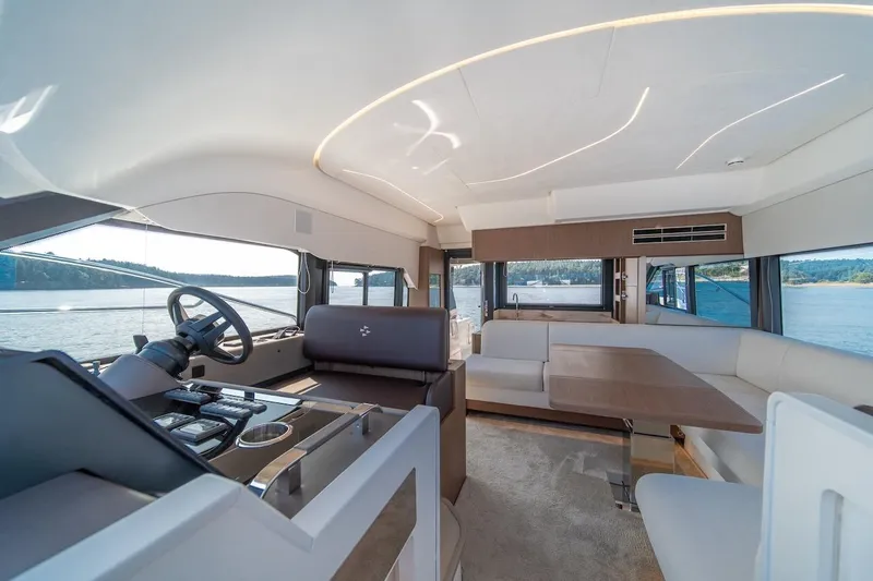 Slide: The Image of Luxurious interior of 2025 Prestige F4.9 yacht with modern helm and seating area. - 36