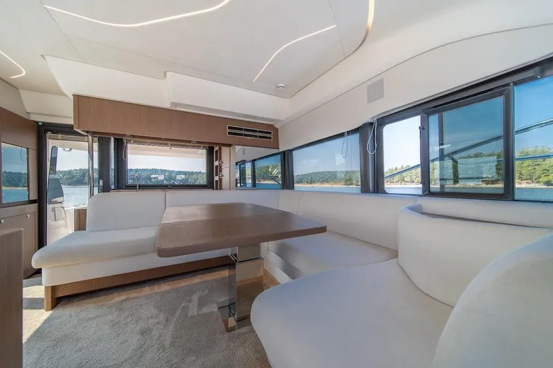 Slide: The Image of Luxurious interior of 2025 Prestige F4.9 yacht with panoramic windows and elegant seating. - 37